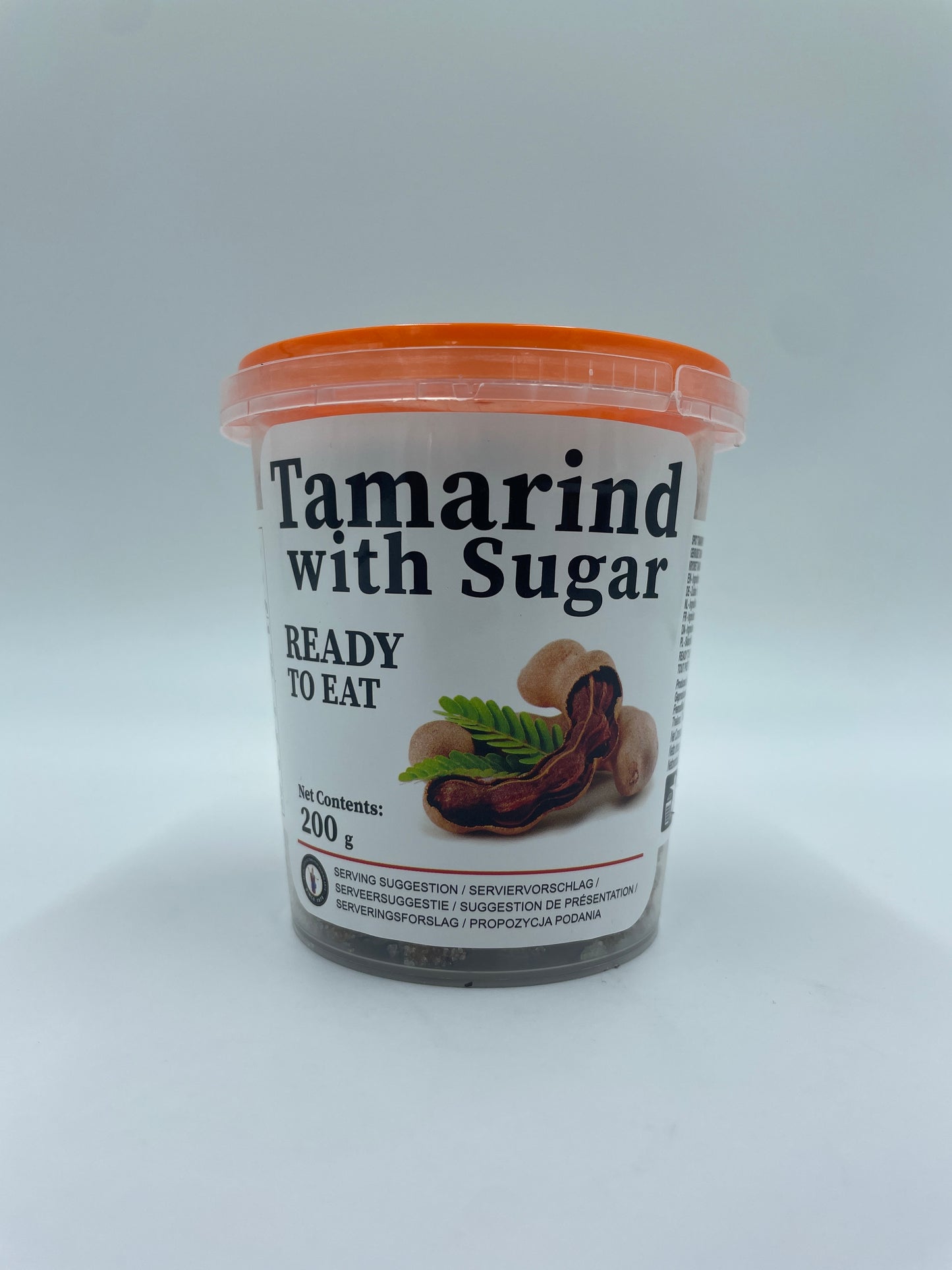 Tamarind med sukker fra FOOD SPECIALIZE, en snacks, viser tamarindfrugt med sukkerbelægning i en klar skål