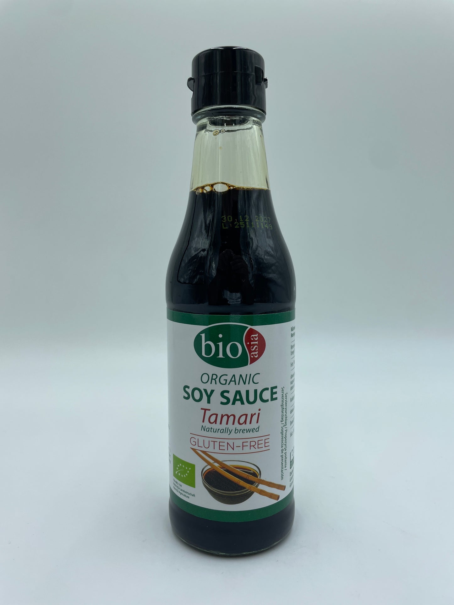 Økologisk soyasauce Tamari fra BIO ASIA, flydende sauce i glasflaske med mørk brun farve og etikette.