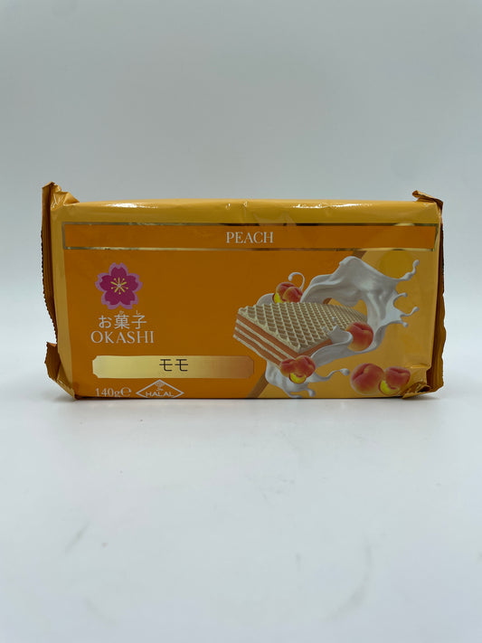 OKASHI Peach smags wafers, sprøde snacks med ferskensmag, vist i billedet.