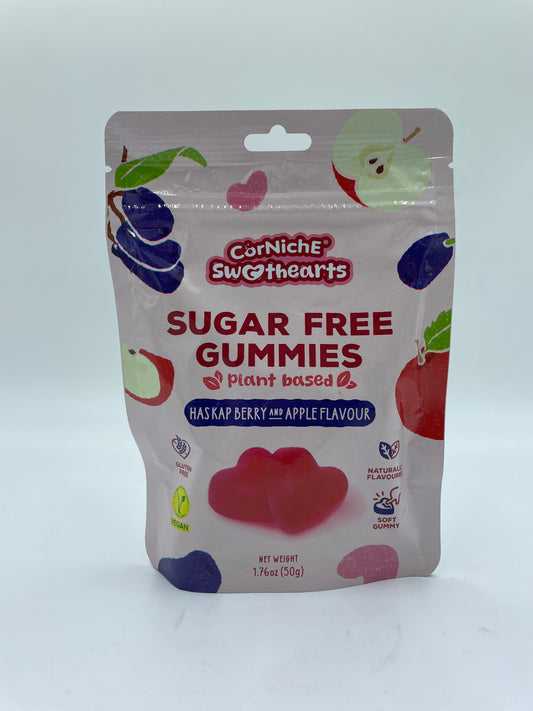 Sukkerfri Gummibamser med Haskap bær og æble smag fra CORNICHE, vises i en klar plastboks med gummibamser.
