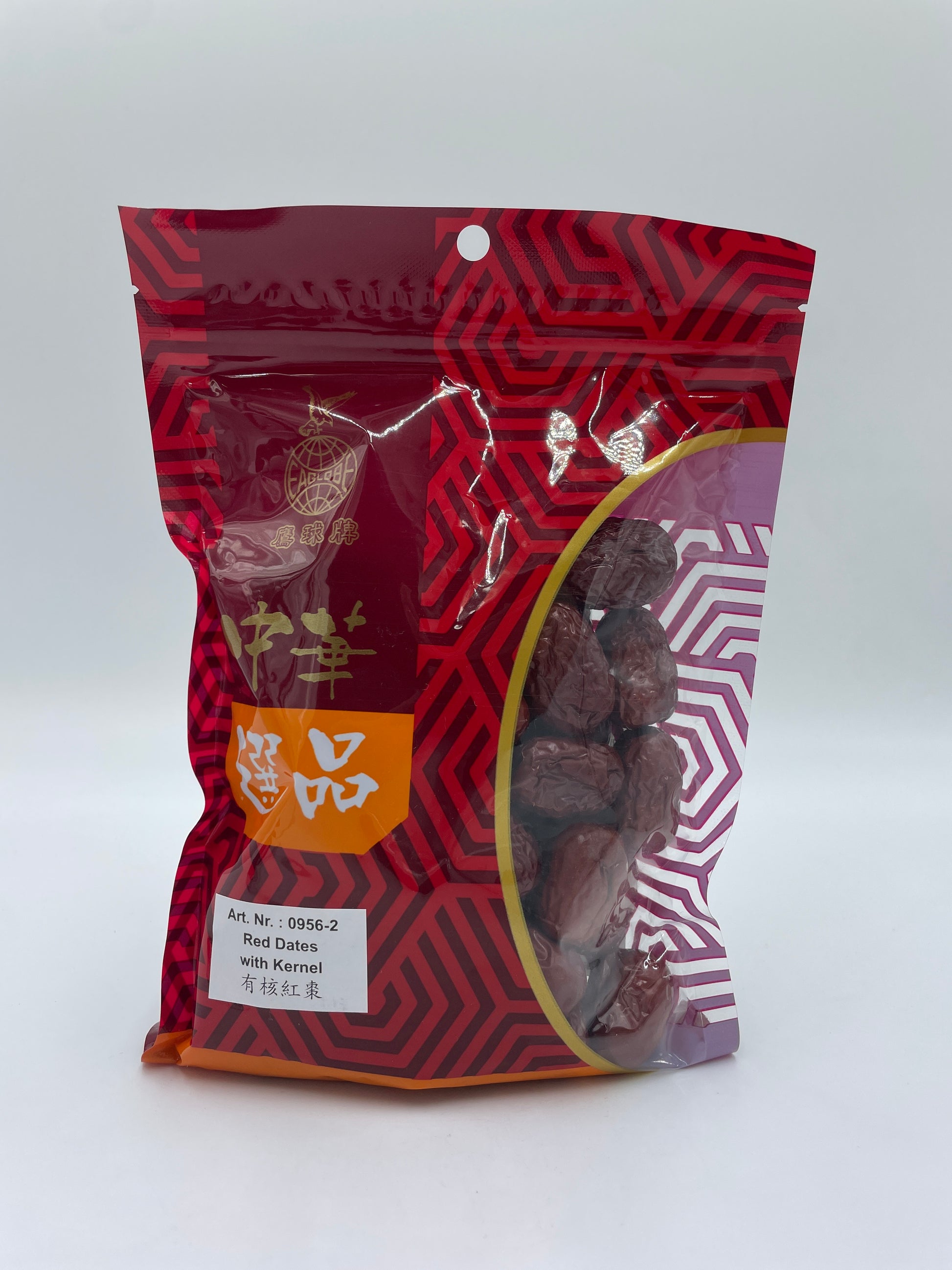 Tørrede røde dadler med kerne fra EAGLOBE, snack med frugt, viser dadlerne i en åben pose med kerner synlige.